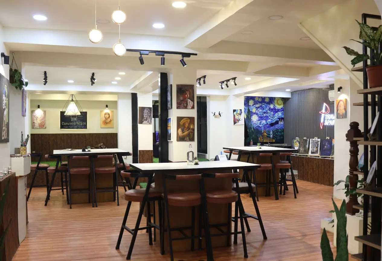 The warm, welcoming interior of the Travel & Paint art studio in Baluwatar, Kathmandu