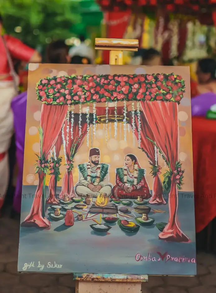 A live wedding painting of a Nepali mandap ceremony on an easel